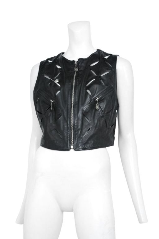 Black leather cropped vest with cross hatched slash detailing and zipper front closure with Medusa stamped zipper pull.