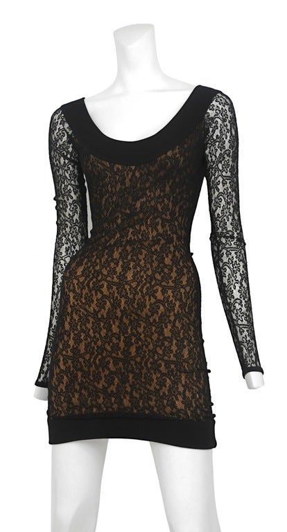 Lace wiggle dress with beige lining and low rib knit scoop neck.
