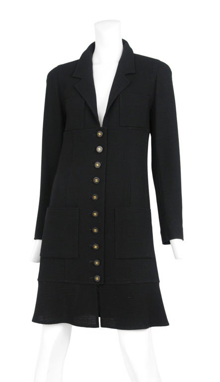 Wool crepe coat dress with CC buttons at front. 4 front patch pockets and a beautiful soft rounded shoulders.