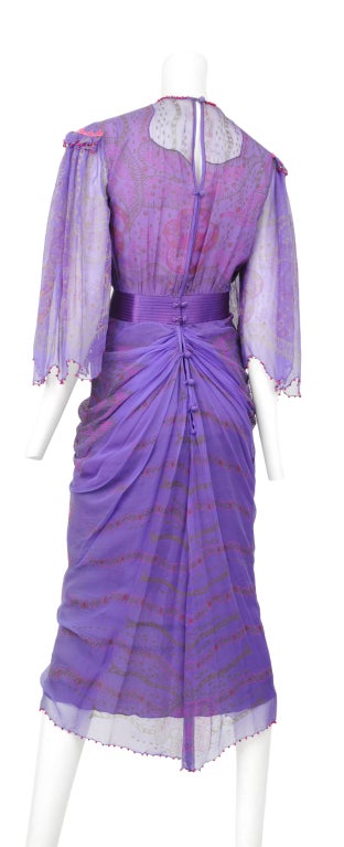 Zandra Rhodes purple chiffon print gown. Sheer sleeves with bright pink pearl trim. Quilted satin waist band with beautiful chiffon covered buttons.