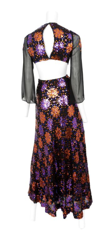 Black chiffon 2pc. heavily encrusted with copper and purple sequins. Zip back closure on skirt and hook and eye closure on top.