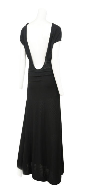 Sheer black knit gown with plunging deep V-back and interesting neck detail.
