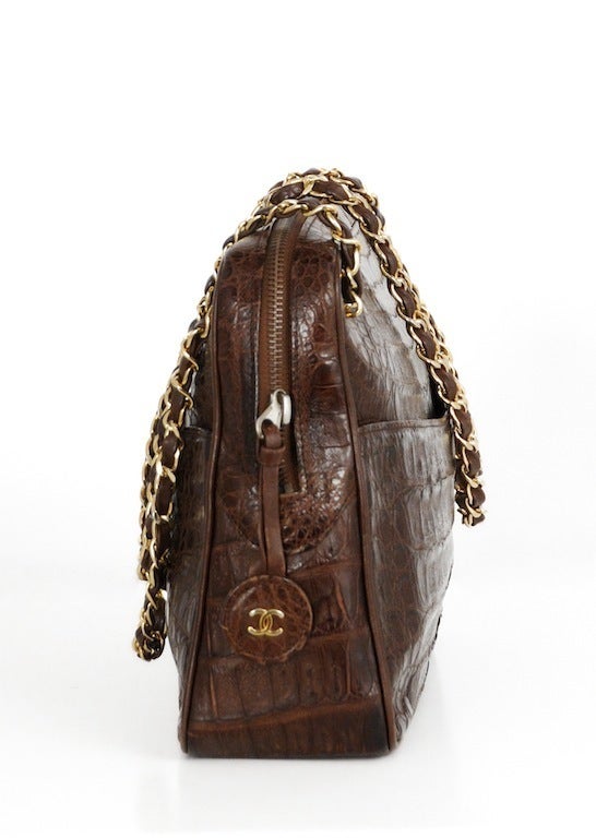Dark chestnut crocodile Chanel shoulder bag. Top zip closure, leather lining and double leather & chain straps. Hologram sticker and Chanel stamp on inside lining.