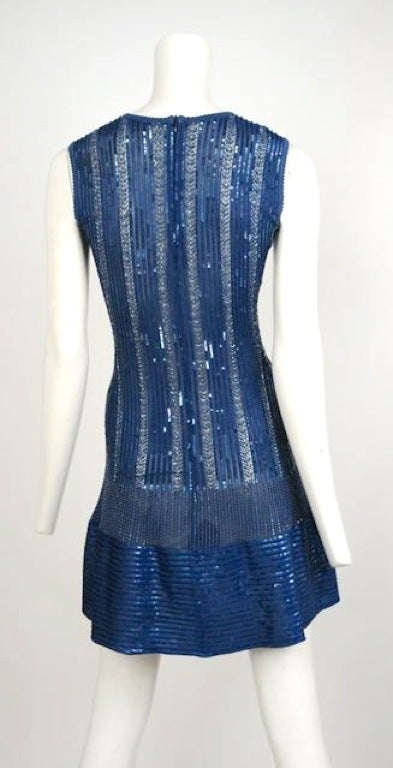 Cobalt blue knit viscose sleeveless dress encrusted with liquid  blue sequins.