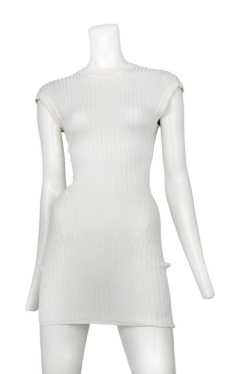 Classic Alaia sheer white ribbed knit mine dress with banded cap sleeves and 
crew-neck.