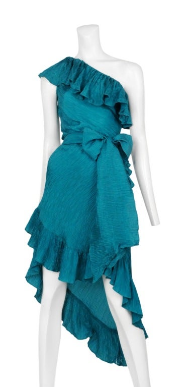 Aqua blue hammered silk asymmetric cocktail dress with diagonal hem and classic YSL ruffle around hem and neckline.