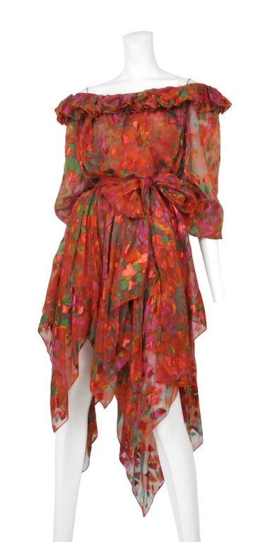 Yves Saint Laurent silk floral two piece. Off shoulder ruffle with sheer billowy sleeves and uneven handkerchief hem line. Comes with a matching slip for underneath and a beautiful sash.