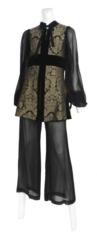 Thea Porter three piece ensemble. Black sheer silk peasant blouse with pussy bow matches a perfectly elegant sheer wide leg pant. Velvet trim and Brocade tunic vest with a sweet mock neck and hook and eye closures.