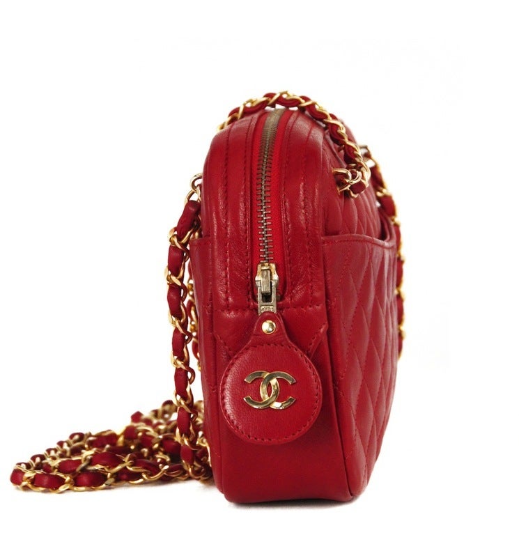 Chanel red quilted shoulder camera bag with CC logo zipper pull and outside slit pockets, Double Chain & leather straps.