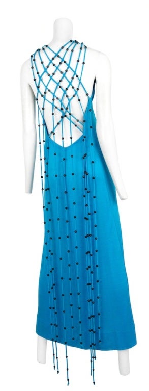 Loris Azzaro teal jersey halter dress with macrame and bead fringe work.