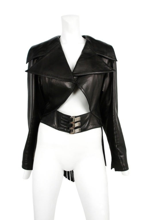 Claude Montana leather jacket with attached fringe belt and large oversized lapel.