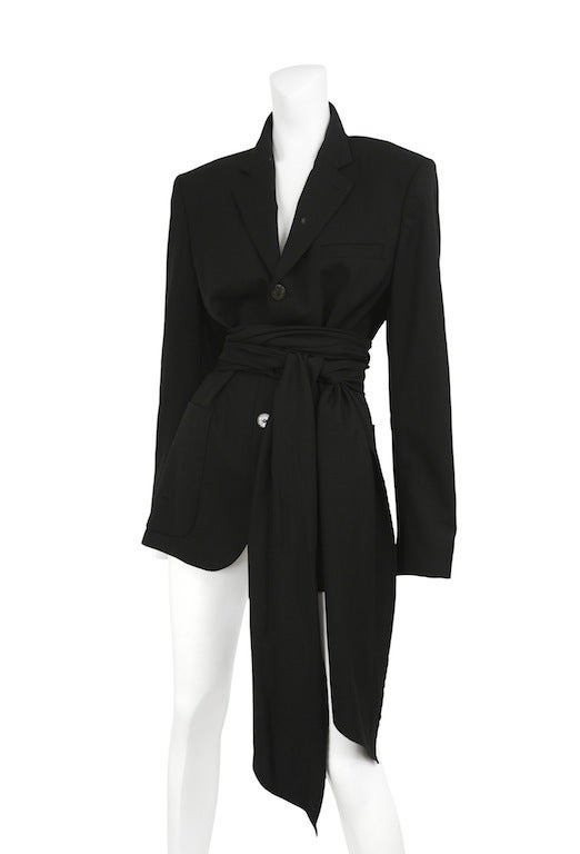 Black open back wrap blazer with belt, oversize pockets and button front closure.