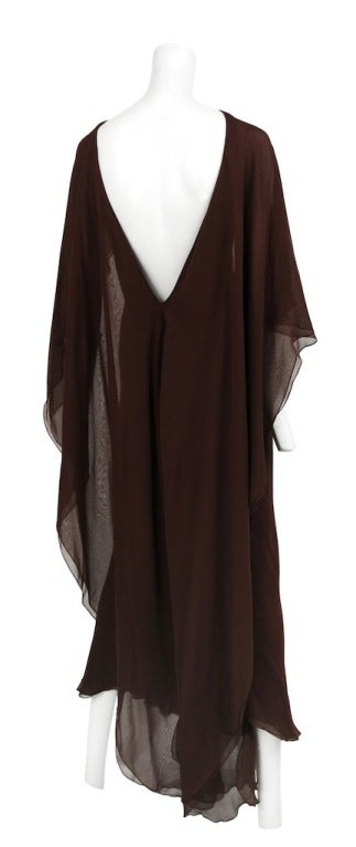 Halston deep brown double layer chiffon backless gown with butterfly ruffle and sleeve detail.