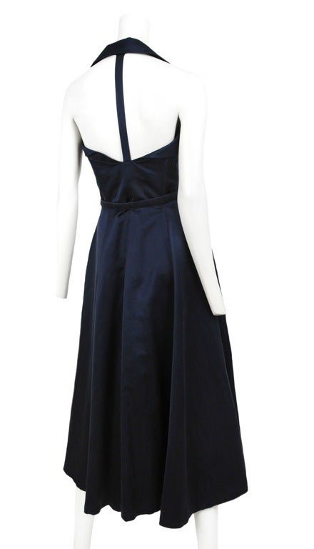 Dark Navy Satin Charmeuse 50’s inspired strapless T back dress with tiny buttons down front and deep pockets. Dress comes with matching thin belt with silver buckle.