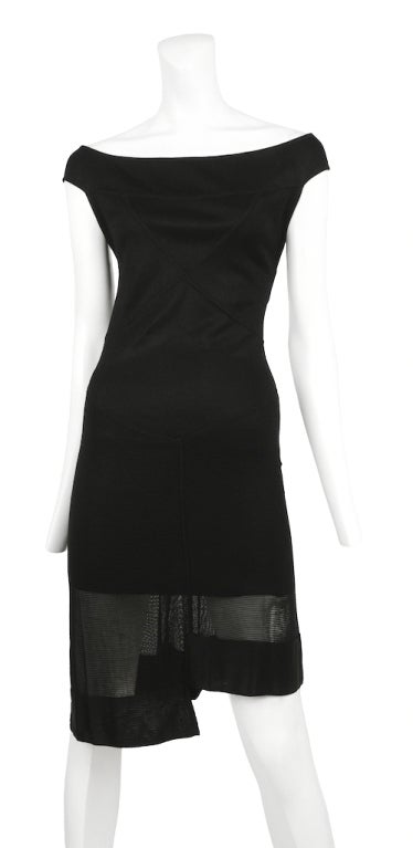Alaia black off shoulder knit mini dress with wide criss cross straps and open back.