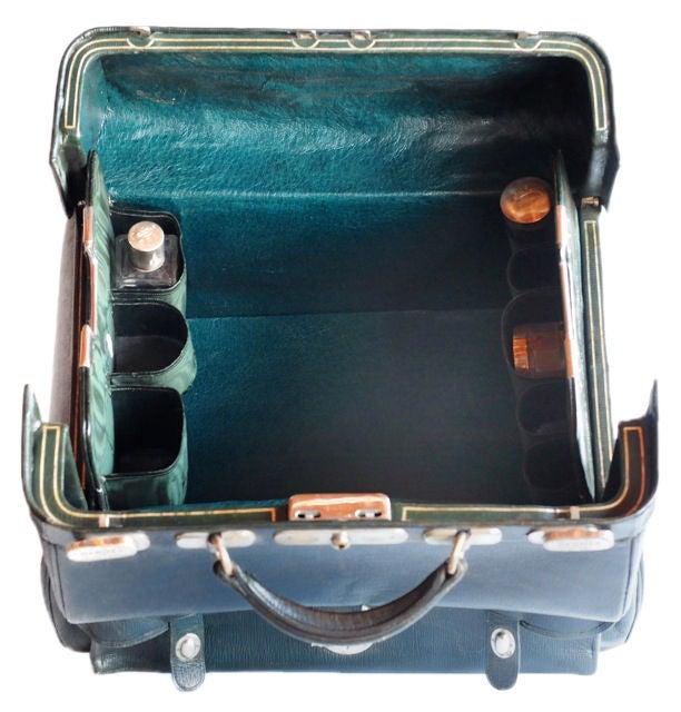 Hermes 1930's toiletry XL travel bag. <br />
This bag is exceptional!  It is done in dark green textured leather with dark green moire fabric lining. It has silver hardware closures at the top and on the large pouch pocket at the side. 3 glass