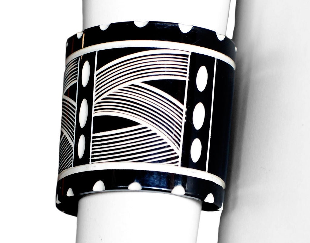 Yves Saint Laurent rare molded and carved runway cuff that was inspired by his own early african collection. This piece is in beautiful condition and would make a wonderful addition to any collection.