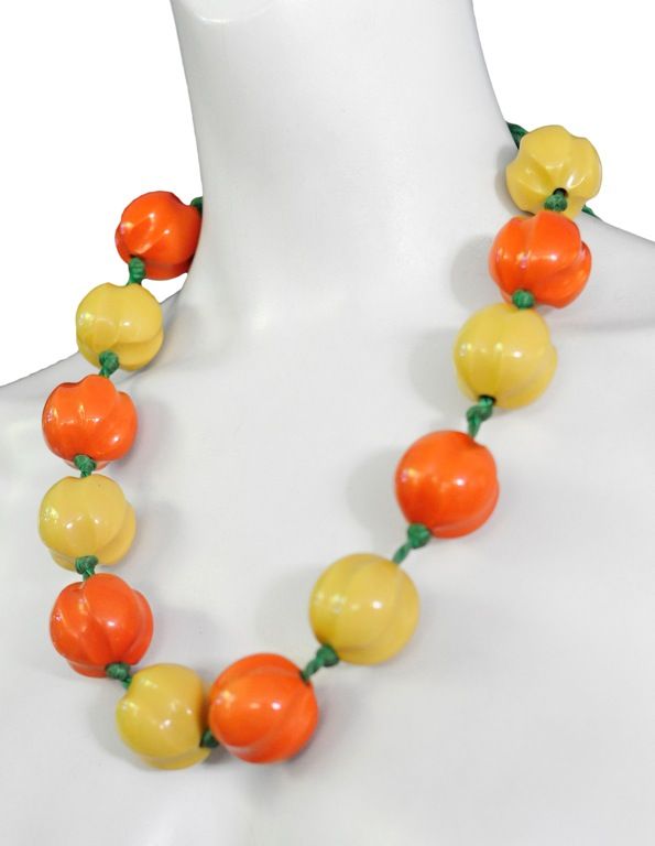 Yves Saint Laurent runway necklace with oversized beads, outstanding!<br />
The beads are vintage c.1940 bakelite and are in impeccable condition. The colors are a saturated orange and yellow. They are threaded on a muted green silk rope with