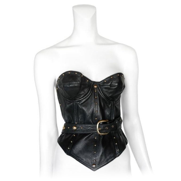 Black leather bustier with wrap around belt and stud detail.