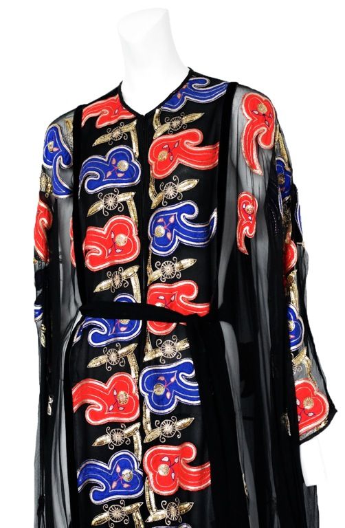 Black Chiffon caftan with gold, red and blue brocade detail panels down front and sleeves with satin belt.