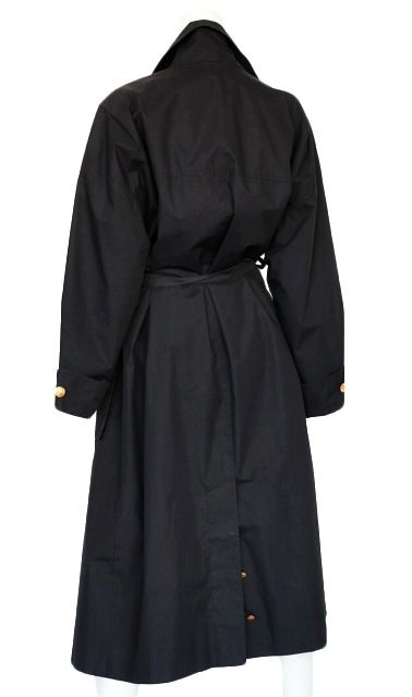 Classic black trench with gold Chanel buttons and large patch pockets with box pleat detail.