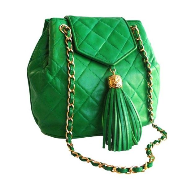 Kelly leather quilted handbag with double leather and chain strap and large tassel at front closure. c. 1980's
