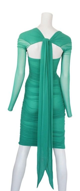Sea foam green mesh dress with long sheer sleeves and open tie back.