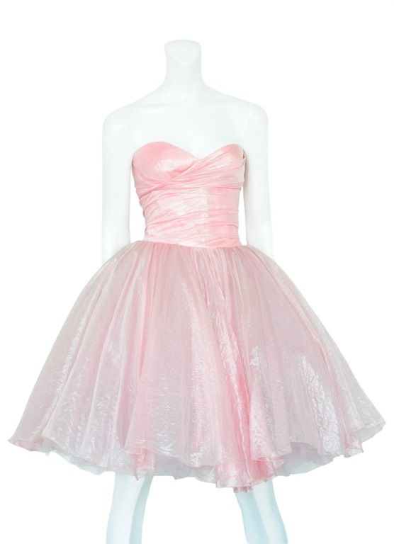 Pink iridescent party dress with tulle petticoat that gives the skirt amazing volume and a strapless bodice with a sweet heart neckline