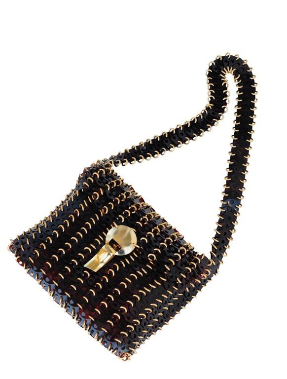 Tortoise disc shoulder bag with gold tone jump rings and clasp closure.