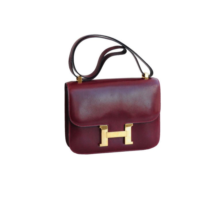 Deep burgundy calfskin leather Constance bag with gold H closure.