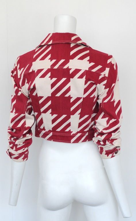 Cropped Motorcycle jacket with oversized houndstooth print on white denim.<br />
Double breasted with wide collar and lapel. c. 1990's