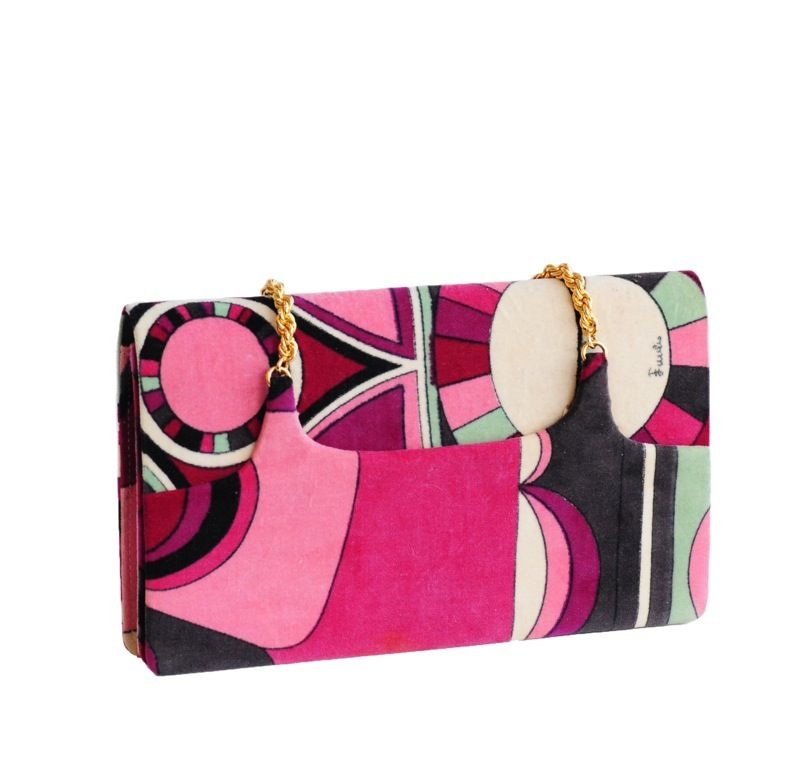 Velvet evening bag with pink, fuchsia, black, cream and mint green geometric print and gold chain strap.   Single flap closure.