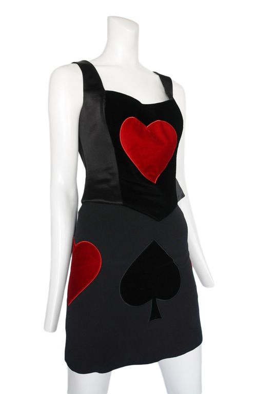 Queen of hearts 2pc. <br />
Black 2pc. ensemble with velvet hearts and clubs appliques. Straight mini skirt and corset shape bodice.