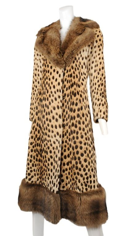 Long leopard coat with wide collar and hem trimmed in mink. <br />
Beautiful cut with high arms holes and slim cut sleeves. The fur soft and is in beautiful condition with no drying.