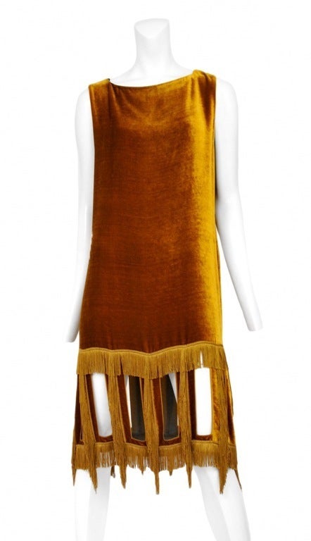 Marigold silk velvet dress with cut out and fringe detailing at hem line. Back zip closure.