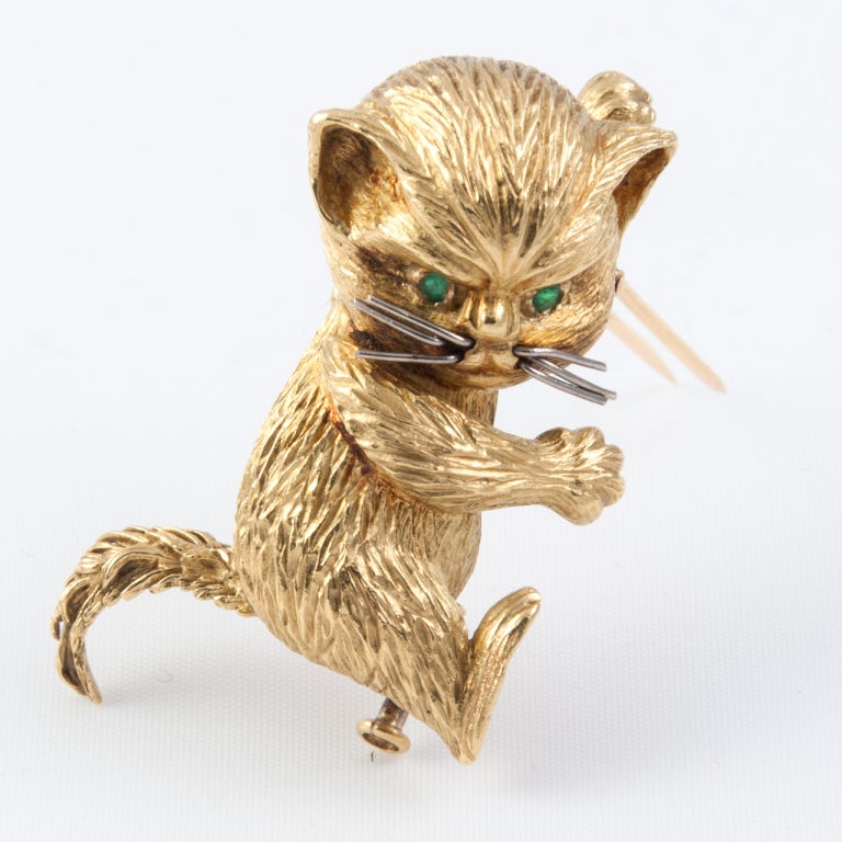 18ct Gold Cat Pin with Emerald eyes and White Gold whiskers. He has a double pin for extra security