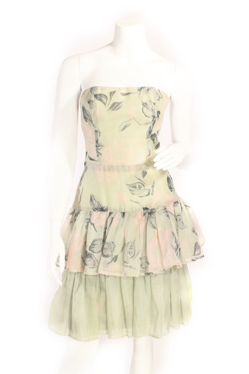 Vintage 1960's floral strapless dress. This dress is boned and has MANY layers of tulle and silk floral fabric. The design is super wearable and just so pretty. The light floral pastel coloring is stunning. Perfect for any summer wedding, getaway,