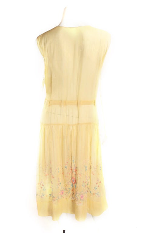 This gorgeous soft yellow coloring is super rear in the classic Czech bohemian style dresses. Everything about this dress is feminine! Featuring fine floral embroidery, smocking, and a drop waist with tie. The coloring on this dress makes the