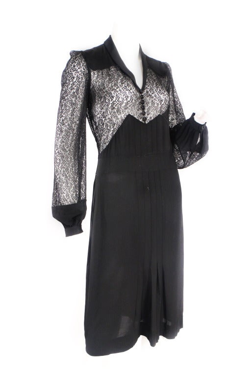 1940's pristine lace dress. This 1940's shape and style is classic and flattering. The lace detail is in mint condition and is super current. Features pleating in the front and snap buttons. The original cut out- yet lady like! Can be worn with a