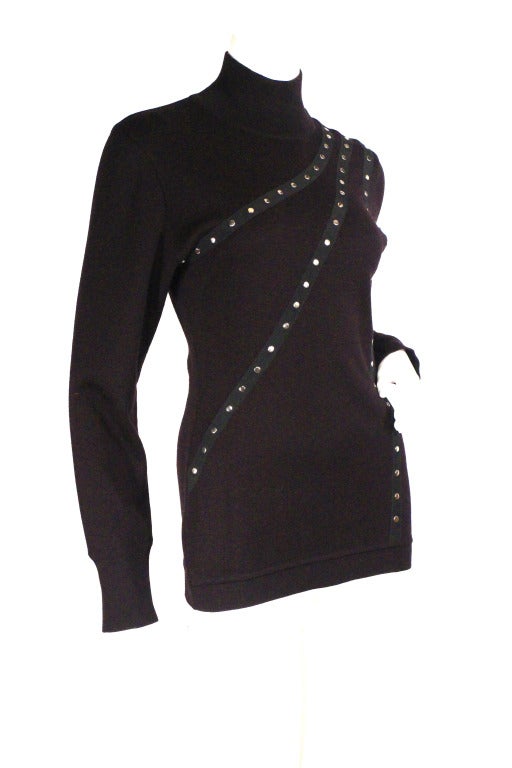 Claude Montana studded sweater. Dark navy with three ribbon pieces featuring silver studs, mock turtleneck. This sweater is perfect the holidays and this coming winter, very wearable!