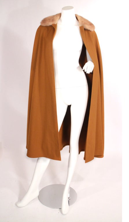 Rare late 1970s Yves Saint Laurent wool cape with fur collar. This cape truly is a timeless YSL gem! Very good condition. 