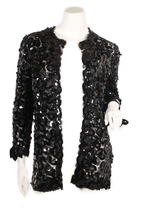 1992 Chanel sequin jacket. Features velvet piping/border (on the inside) and velvet bows on the sleeve. Lined in silk. This jacket is simply gorgeous!