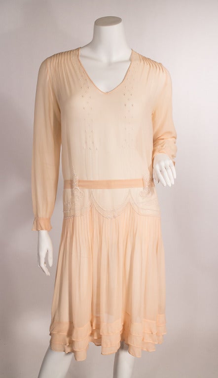 1920s dusty pink sheer dress. Drop waist, pin tucking, and gorgeous white embroidery. This dress is oozing femininity and dying to be worn!
