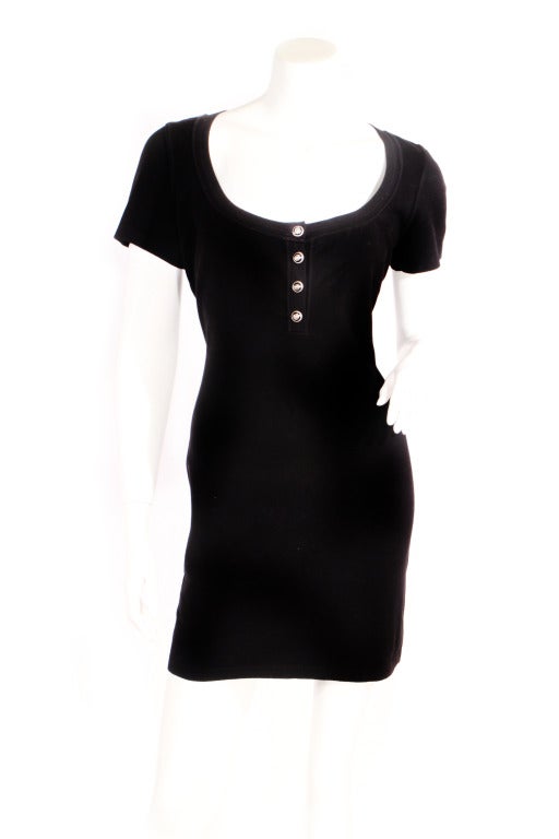 1990s Alaia black mini dress with star buttons. Stretch viscose fabric.
Fits small medium.