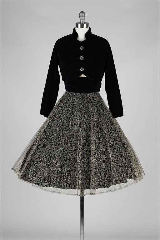 vintage 1950's dress

* gold metallic embroidery
* tulle skirt
* acetate lining
* velvet waist
* matching velvet bolero
* metal side zipper
* by Daryl

condition | excellent - just a few missing stones from buttons

fits like