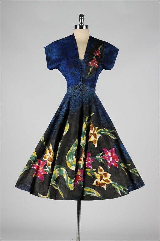 vintage 1950's dress

* beautiful blue and black floral print cotton
* cotton lined bodice
* strapless bodice with stays
* metal side zipper
* full circle skirt
* matching bolero jacket
* by Carol of Mexico

condition | excellent - just a