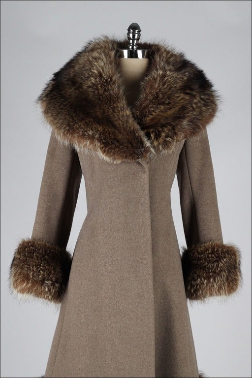 vintage 1960's coat

* mocha wool 
* coyote fur trim
* satin lining
* besom pockets
* snap closure

condition | excellent - few water marks on lining

fits like s/m

length 43