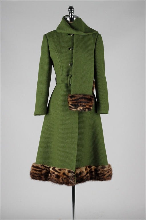 vintage 1960's coat

* green wool
* leopard print rabbit fur trim
* attached scarf
* button front closure
* matching belt
* satin lining
* besom pockets
* by Royal Emblem by Namdlet

condition | excellent - discoloration on lining