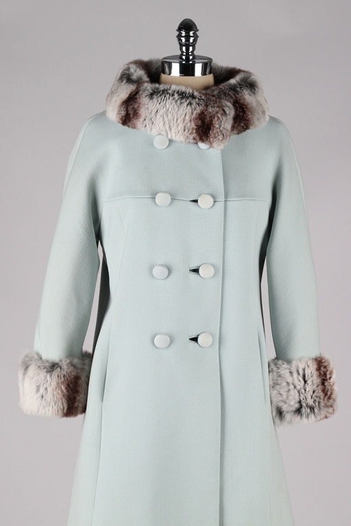 vintage 1960's coat

* powder blue wool
* chinchilla fur trim
* silk crepe lining
* button front closure
* besom pockets
* by Printzess Fashions

condition | excellent

fits like medium

length 36