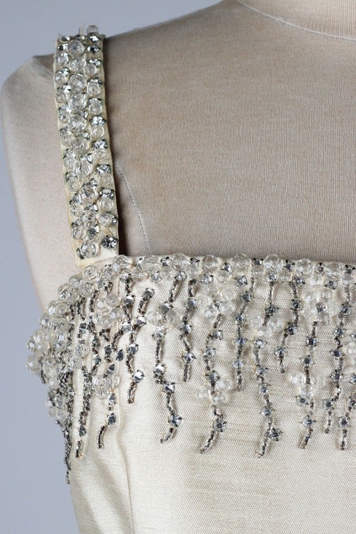 vintage 1960's dress

* ivory silk/wool blend
* acetate lining
* metal side zipper
* beautiful bead work
* by Malcolm Starr

condition | excellent - just a bit of discoloration under the shoulder straps

fits like s/m

length 38